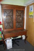 An unusual Oak Writing Table/Bookcase the table having two frieze drawers and standing on stylish