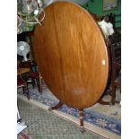 A Regency Mahogany snap-top Hall/Centre Table standing on a turned and lobed column on a platform