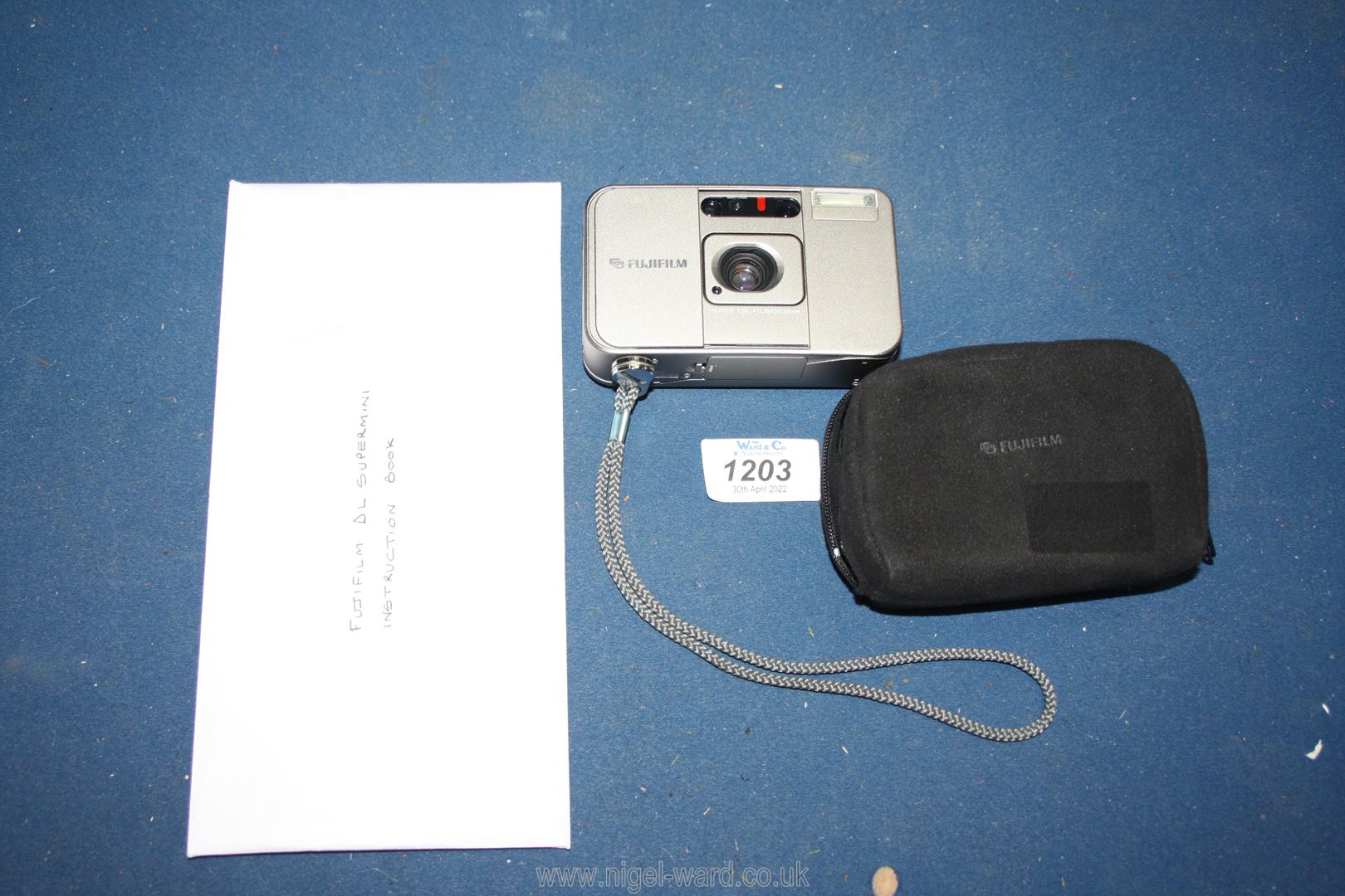 A Fujifilm DL Supermini 35mm camera including case and instruction manual.
