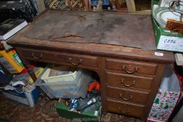 A circa 1900 Oak single pedestal Desk and pedestal with four short drawers,