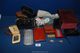 A quantity of miscellanea including Rolls razor, Nikon Zoom camera, Kodak Junior camera,