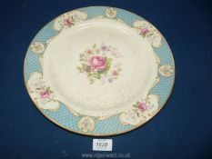 A large Myott pottery plate with floral pattern to centre.