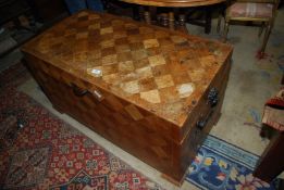 An unusual camphorwood Chest having parquetry finished exterior and with carrying handles and hasps