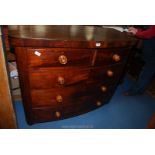 A circa 1900 Mahogany bow fronted Chest of three long and two short drawers with turned wooden