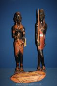 A pair of Maasai Mara African carved figures, shield a/f. 32" tall.