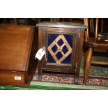A small Cabinet with blue glass panel to door having feature copper diamond decoration,