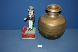A brass Jar, 12'' tall and an iron 'Uncle Sam' money box, 10 3/4'' tall, a/f.