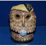 A novelty sculpture of an Owl made from clay with The S.A.S.