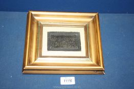 A framed and mounted miniature on compressed horn with an embossed scene of Napoleon's Surrender