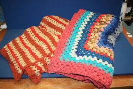 Two single crocheted blankets, one in continual granny square (58'' x 62'') the other in red,