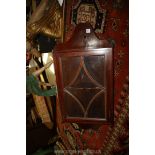 A glazed Mahogany wall hanging corner cabinet, 29 1/2'' high overall.