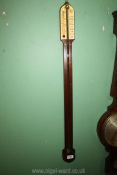 A Stick Barometer by O. Comitti & Son, London, 36 1/2'' long.