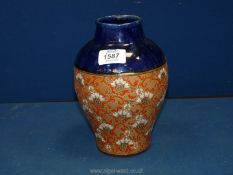 A Royal Doulton Vase with red, gold and white stylised floral decoration, 8'' tall, impressed D.S.