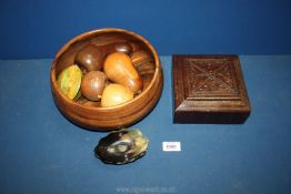 A large treen fruit bowl 10" diameter containing oak, mahogany, holly wood fruits etc.