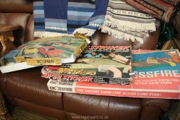 Three vintage games including Matchbox Motorway, Super Striker and Crossfire, some incomplete.