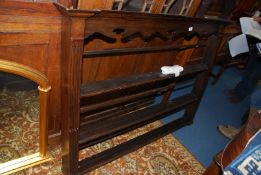 A dark Oak Dresser plate rack having fluted side supports and a fretworked upper frieze 58" wide x