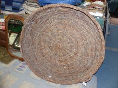 A very large and shallow wicker basket apparently for drying chestnuts, 43'' diameter .