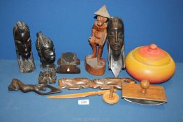 A small quantity of African wooden hand carved items including a tribal woman's head, oriental gent,