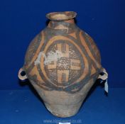 A Chinese Neolilthic double-handed Jar in buff red earthenware painted in black with cross hatched