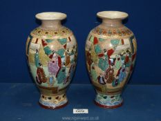 A pair of Satsuma style oriental vases depicting female figures 10" tall.