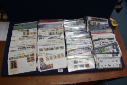 A large quantity of First Day Covers including Christmas 2001/2006 1994, Lest we Forget,