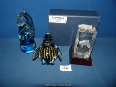 Two Mdina paperweights, a Seahorse and Penguin and a another with etched horse detail.