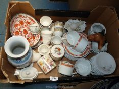 A quantity of china including Ceralene Limoges cups, saucers and plates in orange,