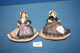 Two small Le Minor jointed dolls in traditional dress.