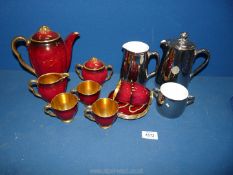 A Carltonware 'Rouge Royale' coffee set minus one cup together with Royal Worcester lustre coffee