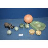 A green onyx ashtray, two carved green stone frogs and stone hippopotamus, trinket pots, etc.