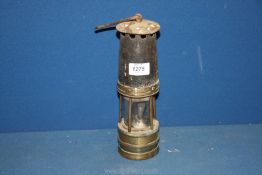 A brass Miner's Lamp marked stamped 896 with 'Hailwoods Combustion Table Lamp' written on the wick