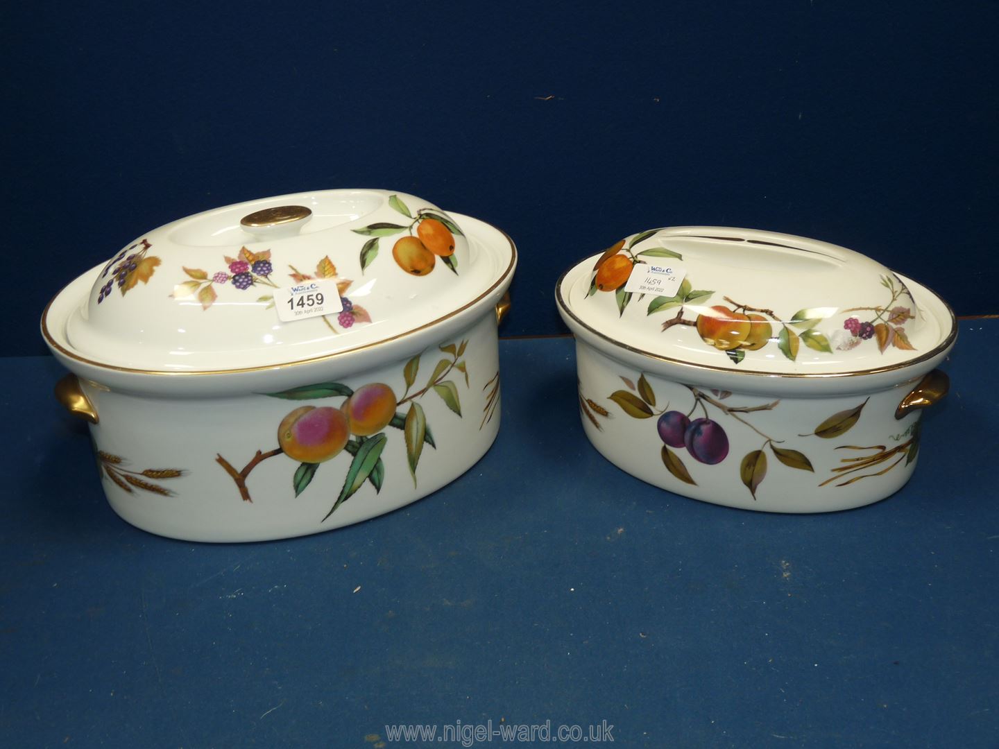 A Royal Worcester Evesham pattern large casserole lidded dish and a medium lidded dish,
