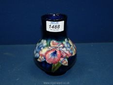 A Moorcroft Blue Orchid baluster vase 5" tall.