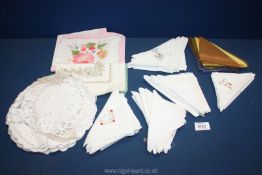 Thirty ladies cotton handkerchiefs and a bag of table mats/doilies and napkins.