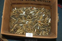 Two trays of empty brass shell cases.