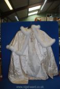 An ivory silk Cape with white fur collar and embroidered edging, size SM.