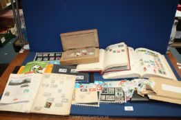 A quantity of stamp albums including an Albion album with very few stamps,