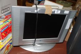 An LG Malatron TV with remote,