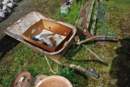 Plastic bird decoys and an old wheel barrow.