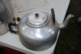 A large aluminium kettle.