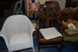 A painted Lloyd Loom style chair and a darkwood hall chair