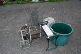 A small roll of wire, kneeler, garden planters, etc.