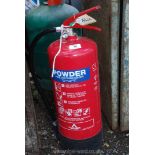 A 9 kilo powder fire extinguisher.