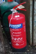 A 9 kilo powder fire extinguisher.