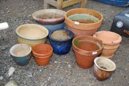 A quantity of planters including terracotta and glazed, etc.