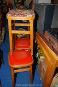 Four kitchen stools with red and floral seats