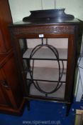 A darkwood oriental style glazed display cabinet with key, 24" wide x 13" x 48" tall.