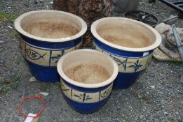 Three glazed pots decorated with fish, 11 1/2'' and 10''.