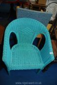 A painted blue Lloyd Loom style chair