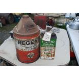 An empty 'Flymo' gallon can and a 'Regent Oil can.